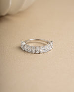 Sterling silver unique diamond ring band on beige surface