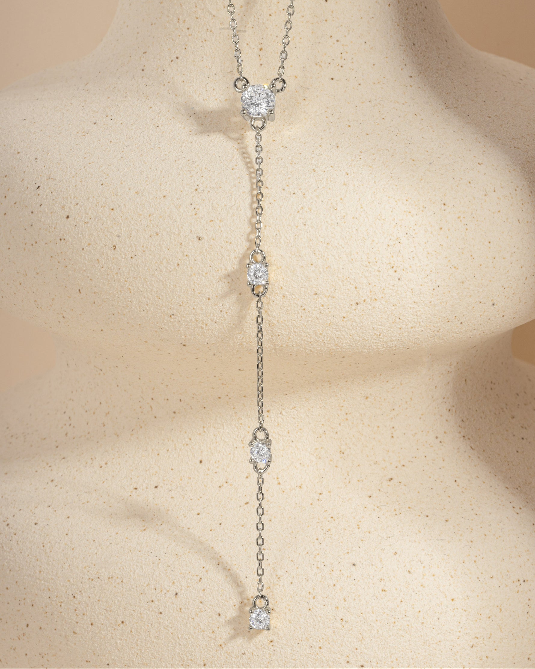 Delicate silver chain necklace with small diamond pendants