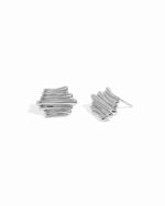 Sterling silver trendy stud earrings on a white background