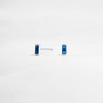 closeup image of minimalist blue earrings