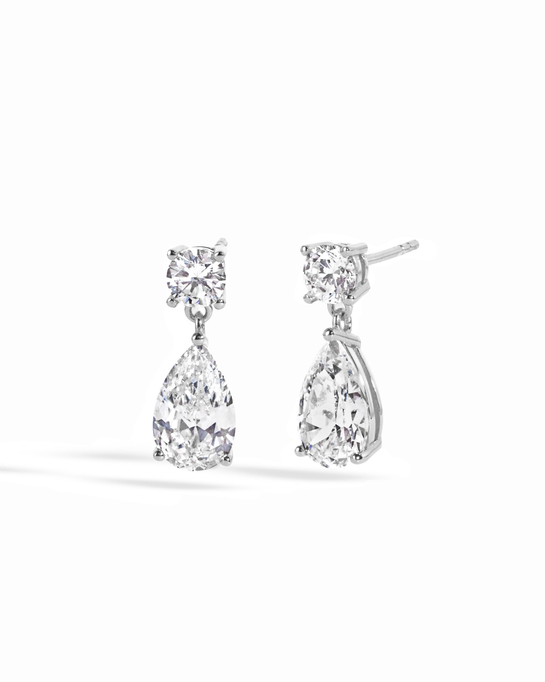 Sterling silver elegant earrings featuring a diamond drop earring design