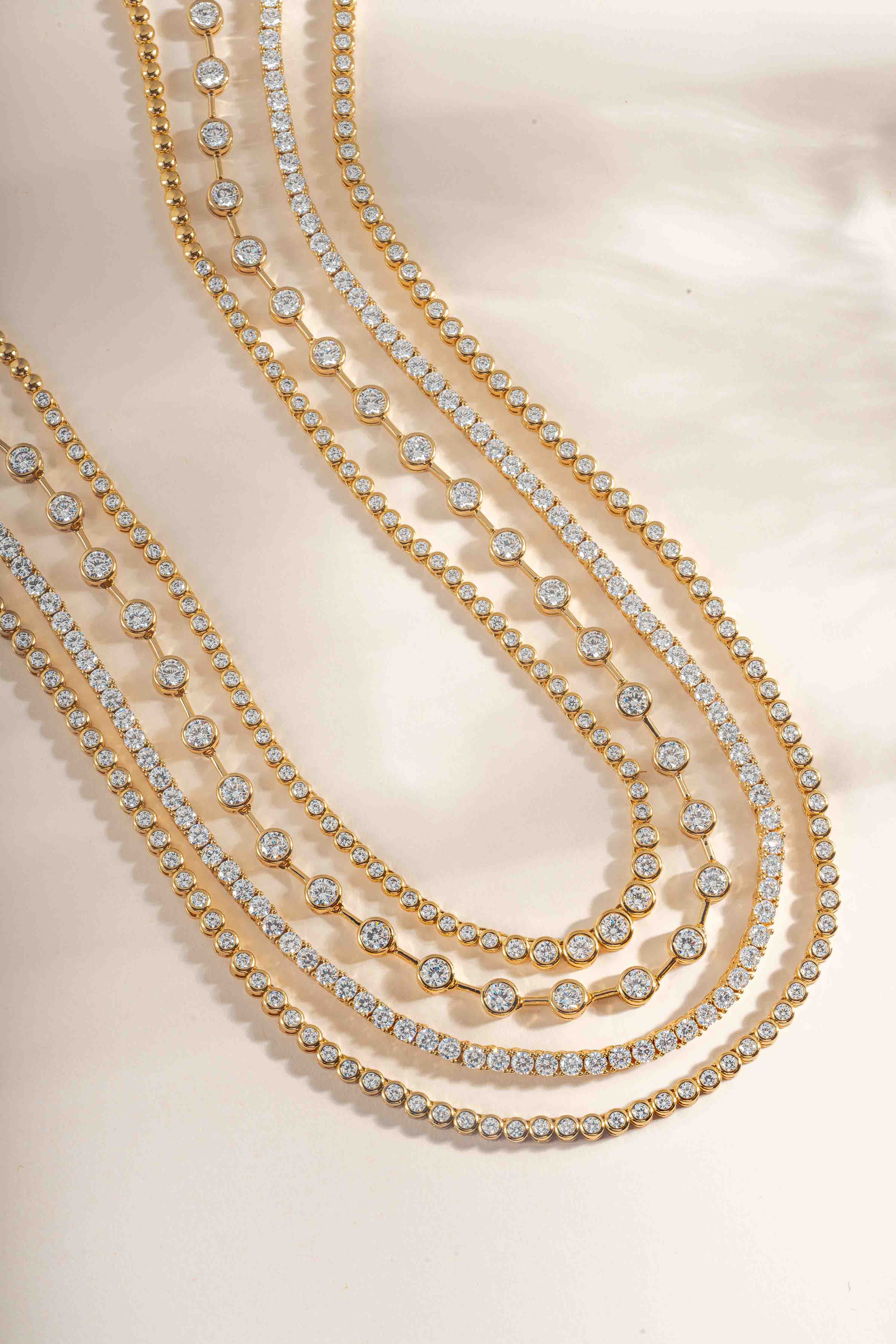 set of different style tennis necklaces