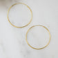 closeup image of gold threader earrings