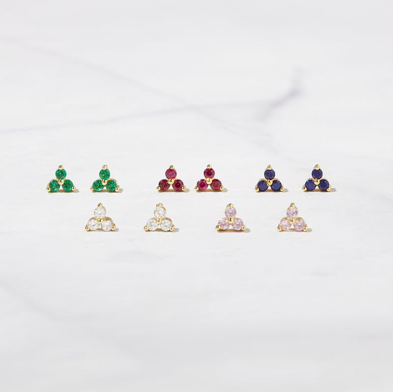 Tiny gold stud earrings in emerald, ruby, sapphire, white cubic zirconia, and light pink