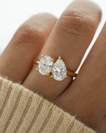 Gold oval engagement ring on model