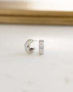 Silver bezeled chunky hoop earrings by Sami Jewels featuring bold, stylish hoop designs for a modern look.
