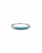 Silver ring with turquoise cz stones on a white background
