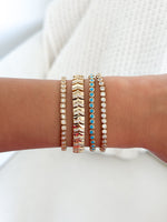 Turquoise bezel tennis bracelet by Sami Jewels featuring a row of turquoise stones set in a sleek metal bracelet.