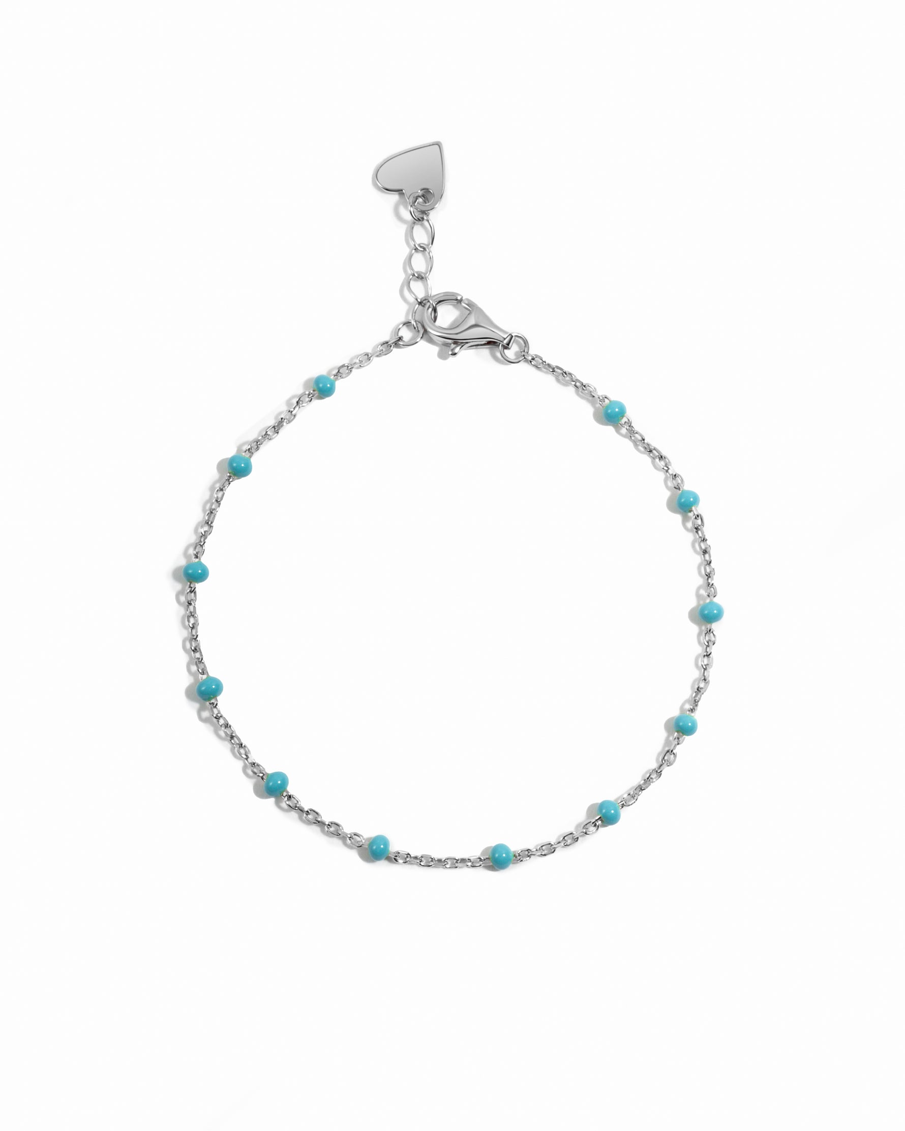 Silver bracelet with turquoise beads on a white background