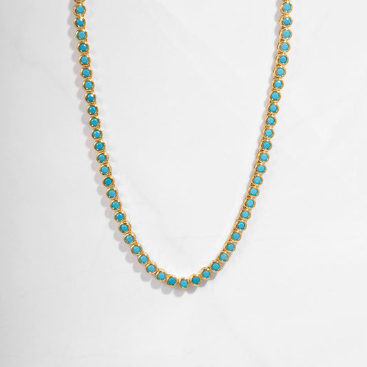 Turquoise beaded necklace on a white background