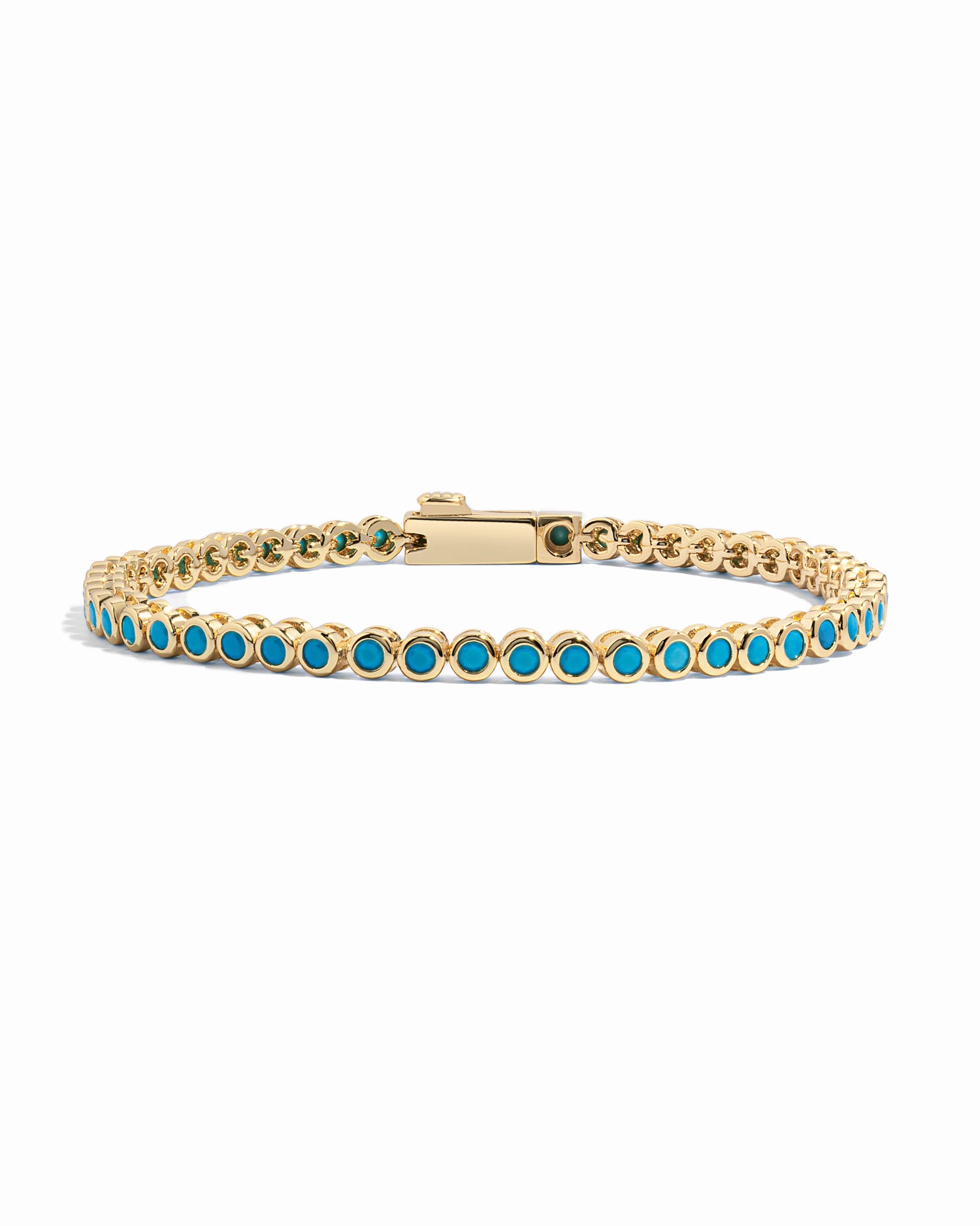 A gold bezel tennis bracelet featuring a continuous row of round turquoise-blue gemstones, displayed on a clean white background.