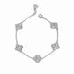 close up of silver charm bracelet of 5 four leaf clover charms