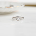 closeup image of silver vintage ring with an oval pearl 