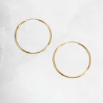 Skinny Hoop earrings in gold