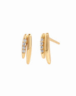 Gold stud earrings on a white background