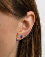 Sapphire Baguette Huggie Earrings by Sami Jewels, silver earrings featuring rectangular-cut blue sapphires in a huggie style.