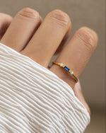 Gold Sapphire Baguette Ring by Sami Jewels featuring a stunning blue sapphire gemstone and elegant baguette-cut design.