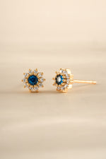 Gold Sapphire Dainty Flower Stud Earrings by Sami Jewels featuring small, delicate flower-shaped gemstone design.