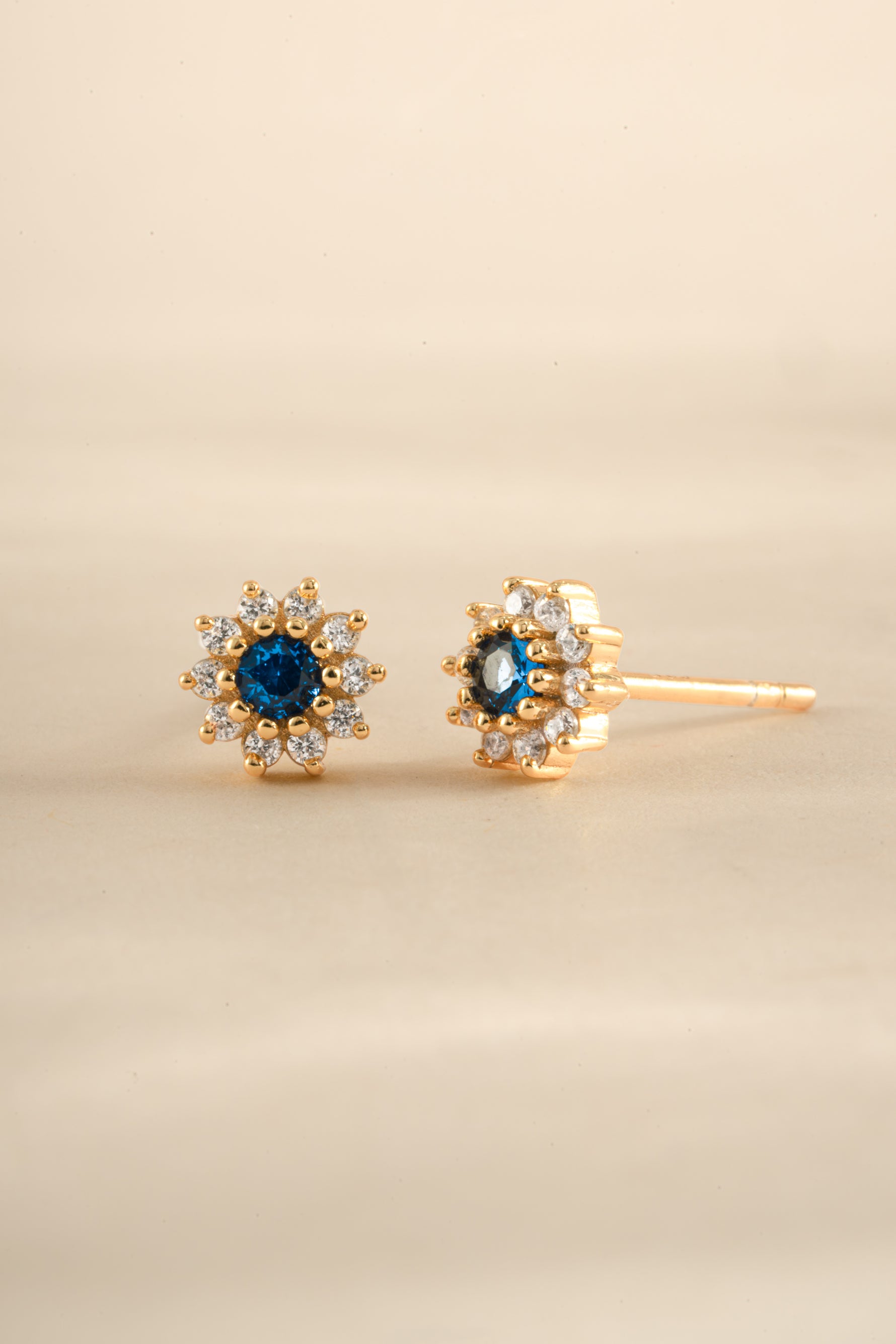 Gold Sapphire Dainty Flower Stud Earrings by Sami Jewels featuring small, delicate flower-shaped gemstone design.
