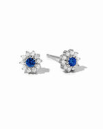 Sapphire dainty flower stud earrings by Sami Jewels featuring sterling silver and white background.