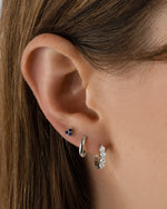 Sterling silver Tiny Sapphire 3 Stone Stud Earrings by Sami Jewels featuring small blue sapphires set in a classic design.