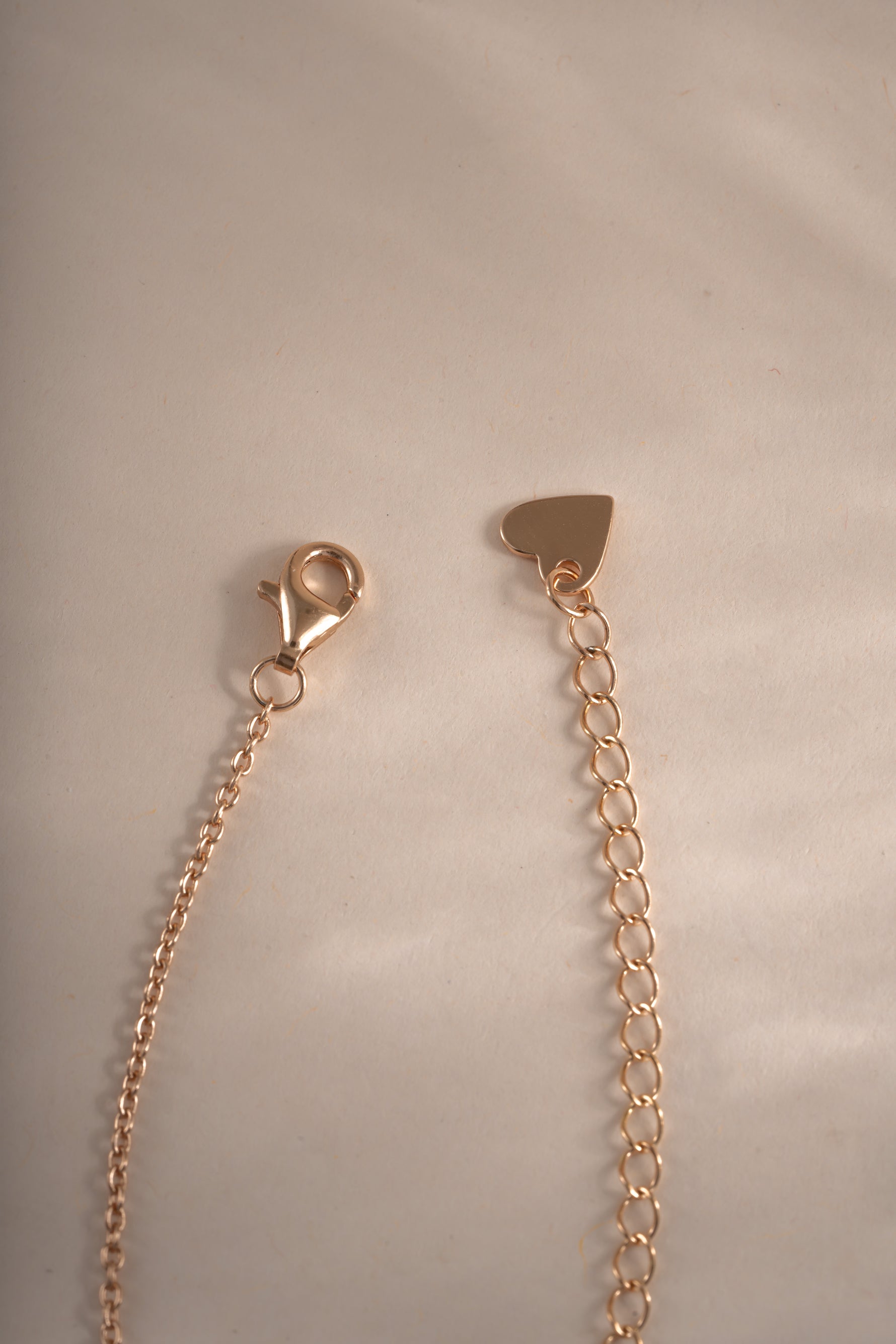 Sapphire evil eye necklace from Sami Jewels with rose gold chain and lobster clasp closure, featuring a blue sapphire evil eye pendant.
