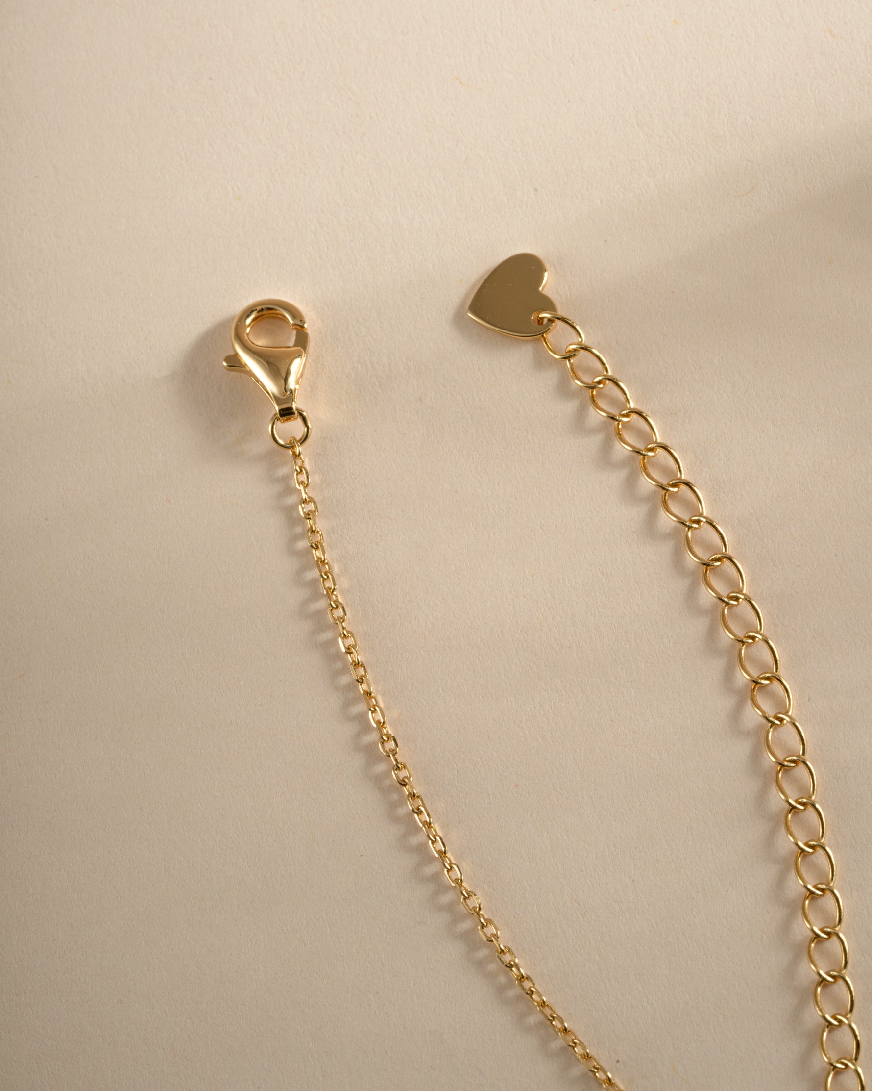 Gold Sapphire Flower Necklace by SJ Faire featuring a delicate sapphire flower charm and lobster clasp closure.