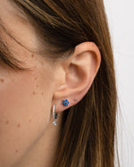 Sami Jewels sapphire flower stud earrings featuring gold settings and intricate petal design, perfect for elegant everyday wear.