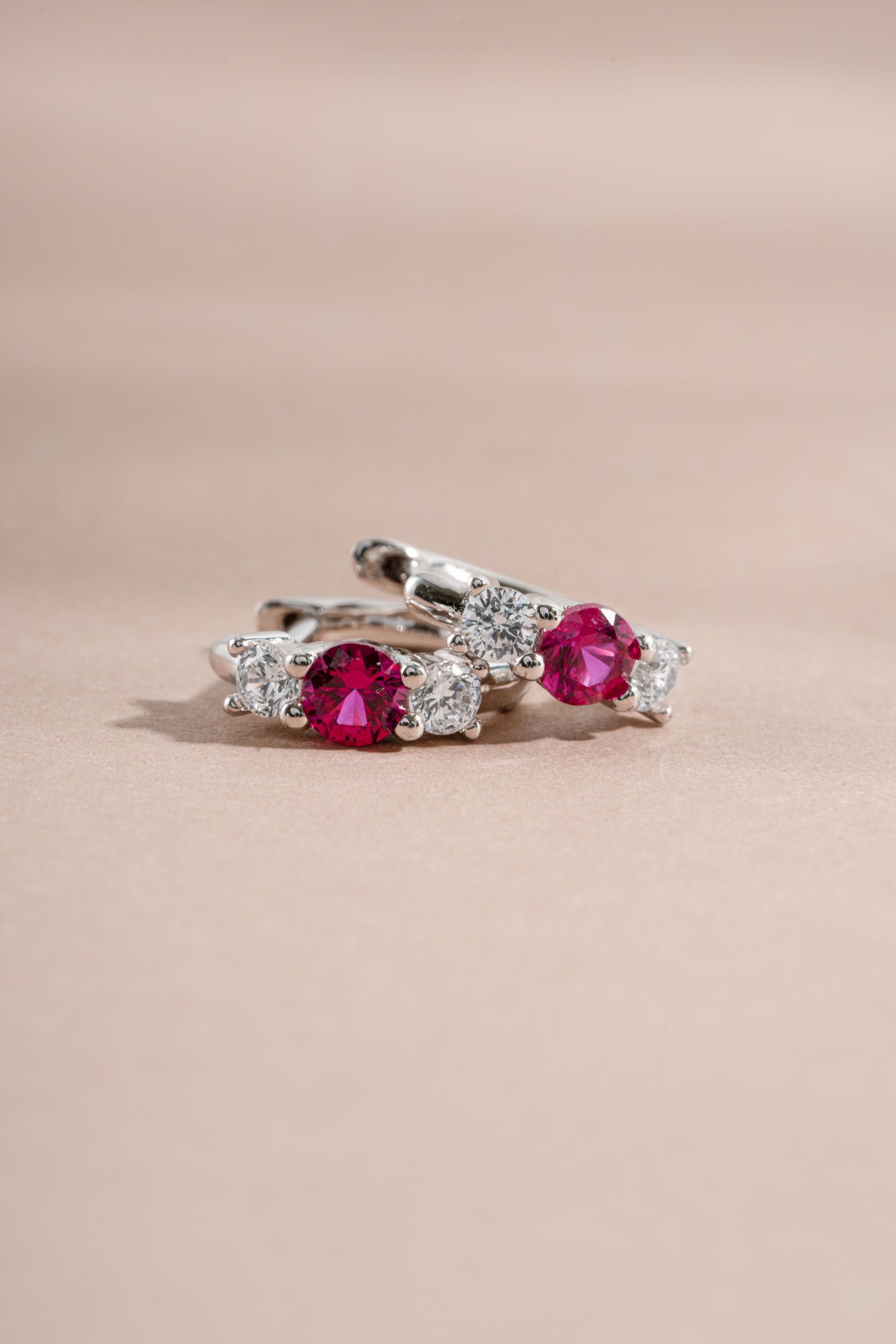 ruby three stone huggie earring sterling silver closeup