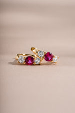 ruby three stone huggie earring closeup