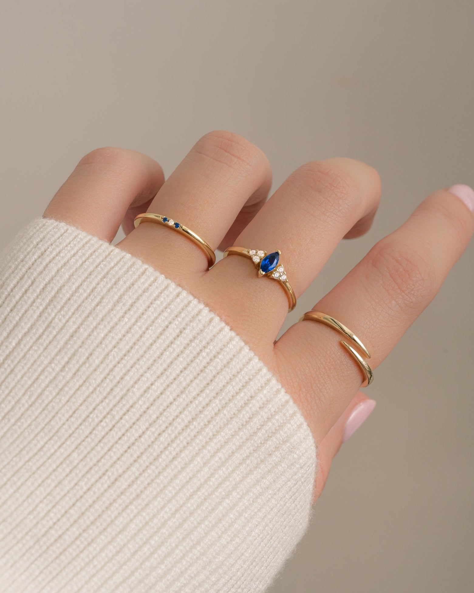 Gold sapphire marquise ring by Sami Jewels featuring a sleek marquise-cut sapphire gemstone set in elegant gold.
