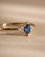 Close-up of Sami Jewels sapphire marquise ring with gold band, showcasing the elegant marquise-shaped blue sapphire gemstone.