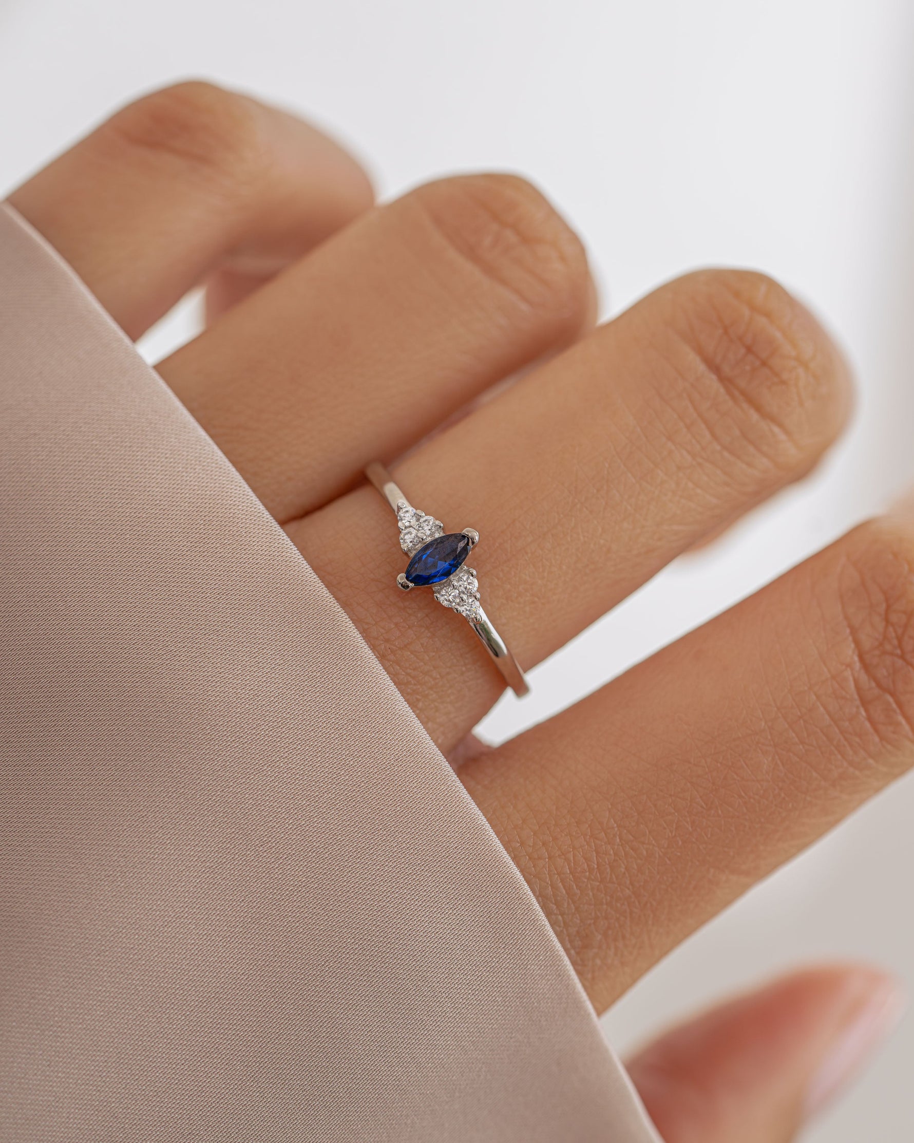 Sterling silver Sapphire Marquise Ring by Sami Jewels featuring a prominent marquise-cut blue sapphire gemstone.