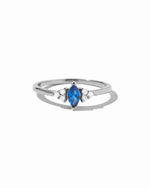 Sami Jewels sapphire marquise ring featuring a sterling silver band and a prominent marquise-cut blue sapphire gemstone.