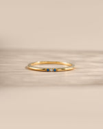 3 stone sapphire ring in gold closeup 