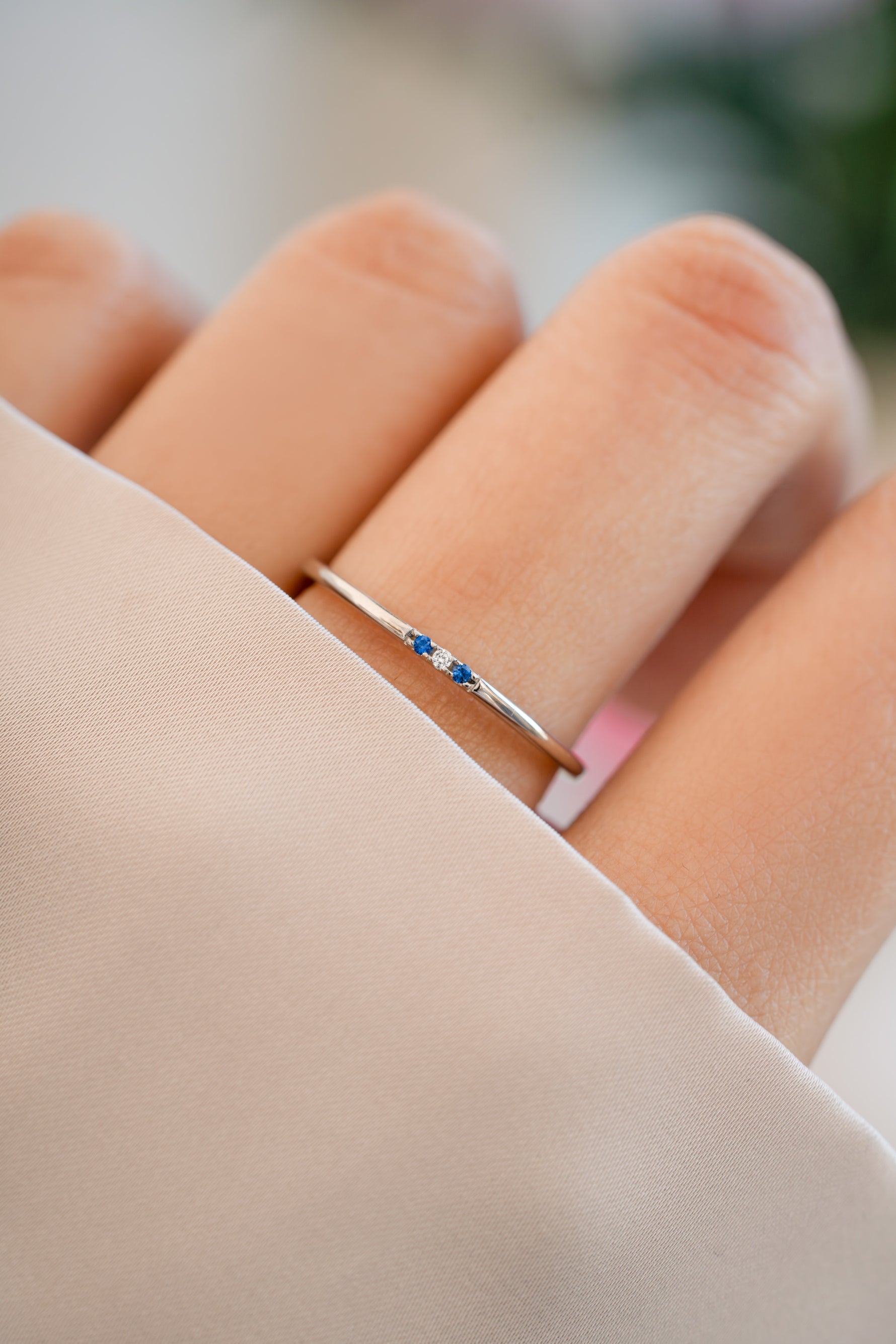 3 stone sapphire ring in sterling silver on models hand
