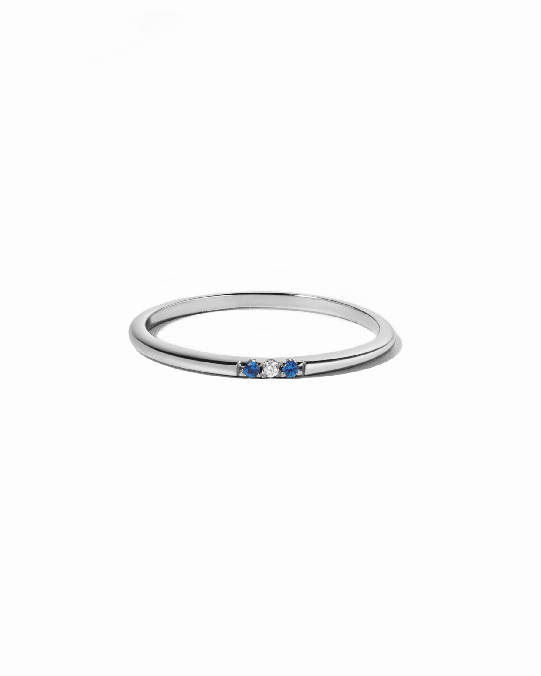 3 stone sapphire ring in sterling silver on a white background