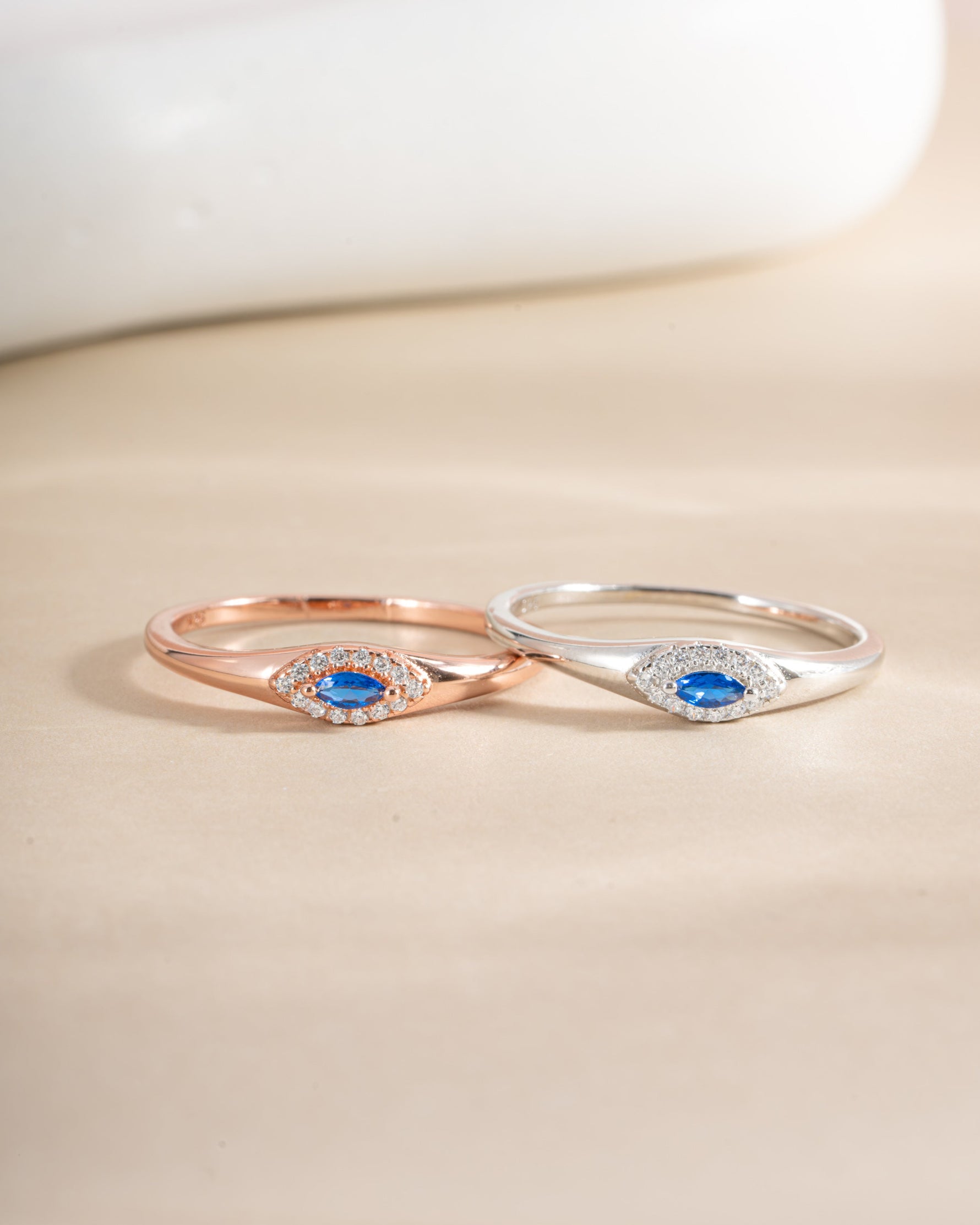 Sapphire Evil Eye Ring in rose gold and sterling silver, featuring a detailed sapphire eye design, from Sami Jewels.