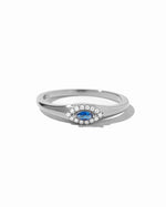 Sterling silver Sapphire Evil Eye Ring with blue gemstone accent, designed by Sami Jewels, on a white background.