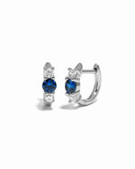 sapphire three stone huggie hoop earring sterling silver white background
