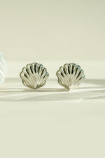 Silver stainless steel SS Shell earrings by Sami Jewels featuring a smooth, polished shell design with a waterproof finish.