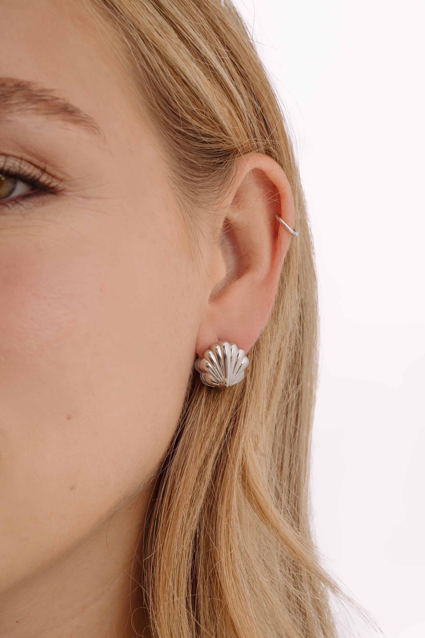 Silver stainless steel SS Shell Earrings by Sami Jewels featuring a sleek, waterproof design with a natural shell shape.