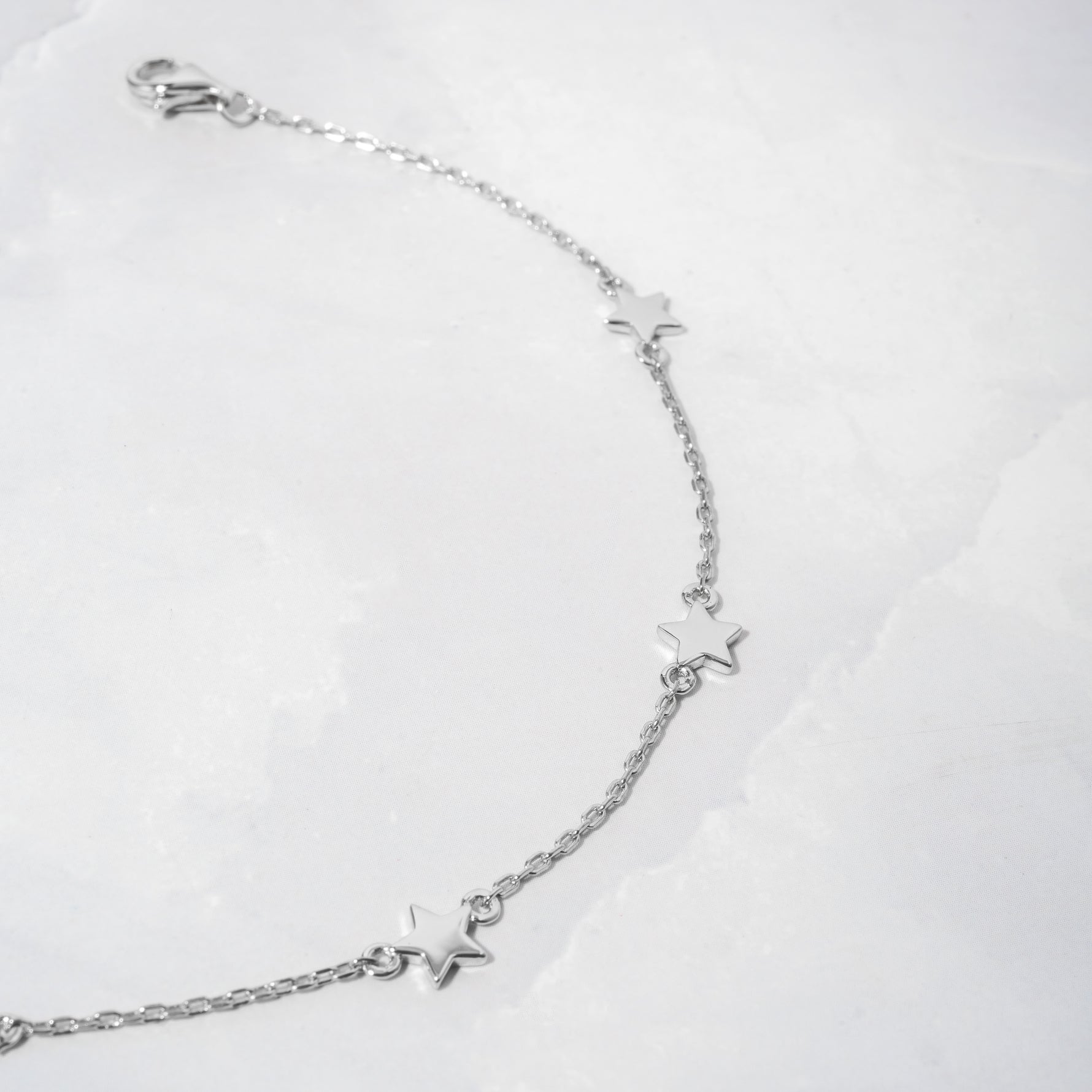 silver anklet with star charm