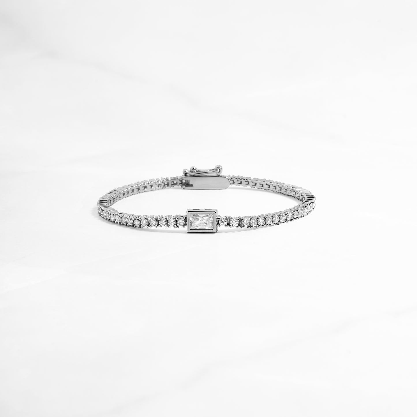 Silver Bezeled Emerald-Cut Charm Tennis Bracelet on white background by Sami Jewels