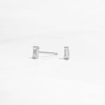 closeup image of silver stud earrings