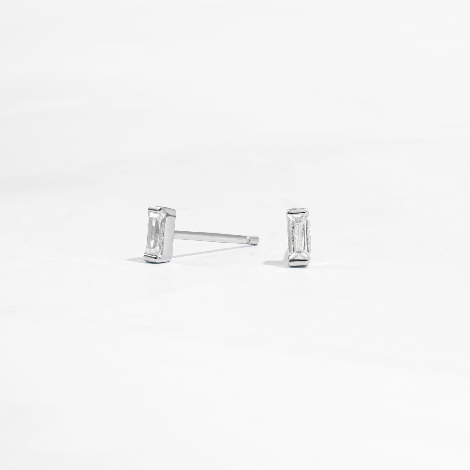 closeup image of silver stud earrings