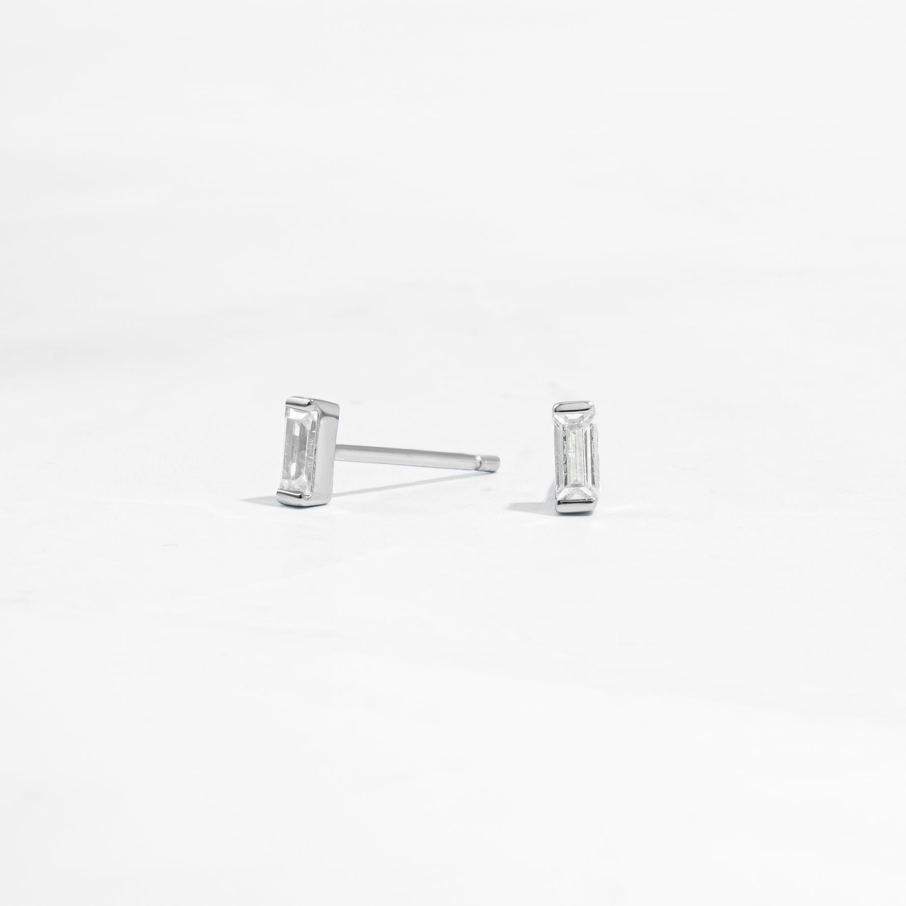 closeup image of silver stud earrings