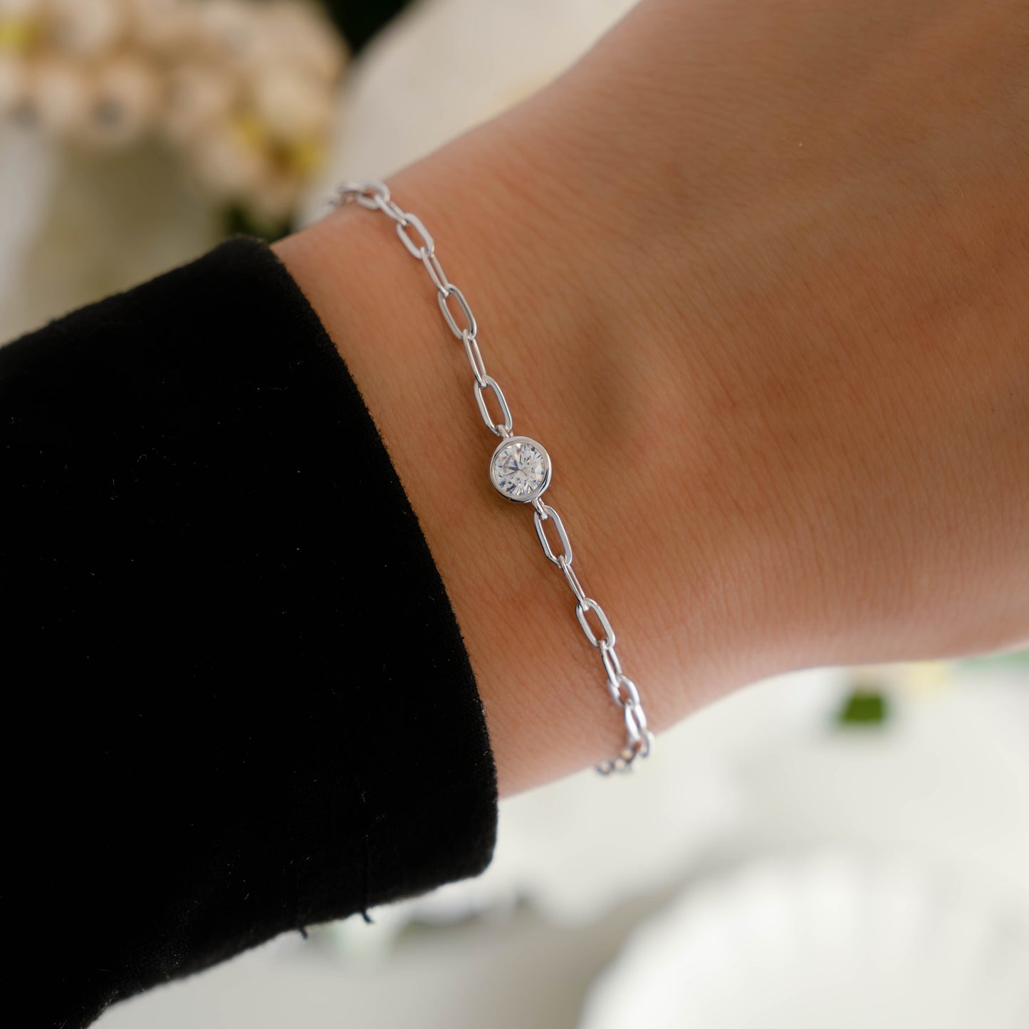 Silver Diamond Bezel Paperclip Bracelet on wrist