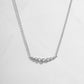 U Curved Diamond Bezel Necklace in silver on white background