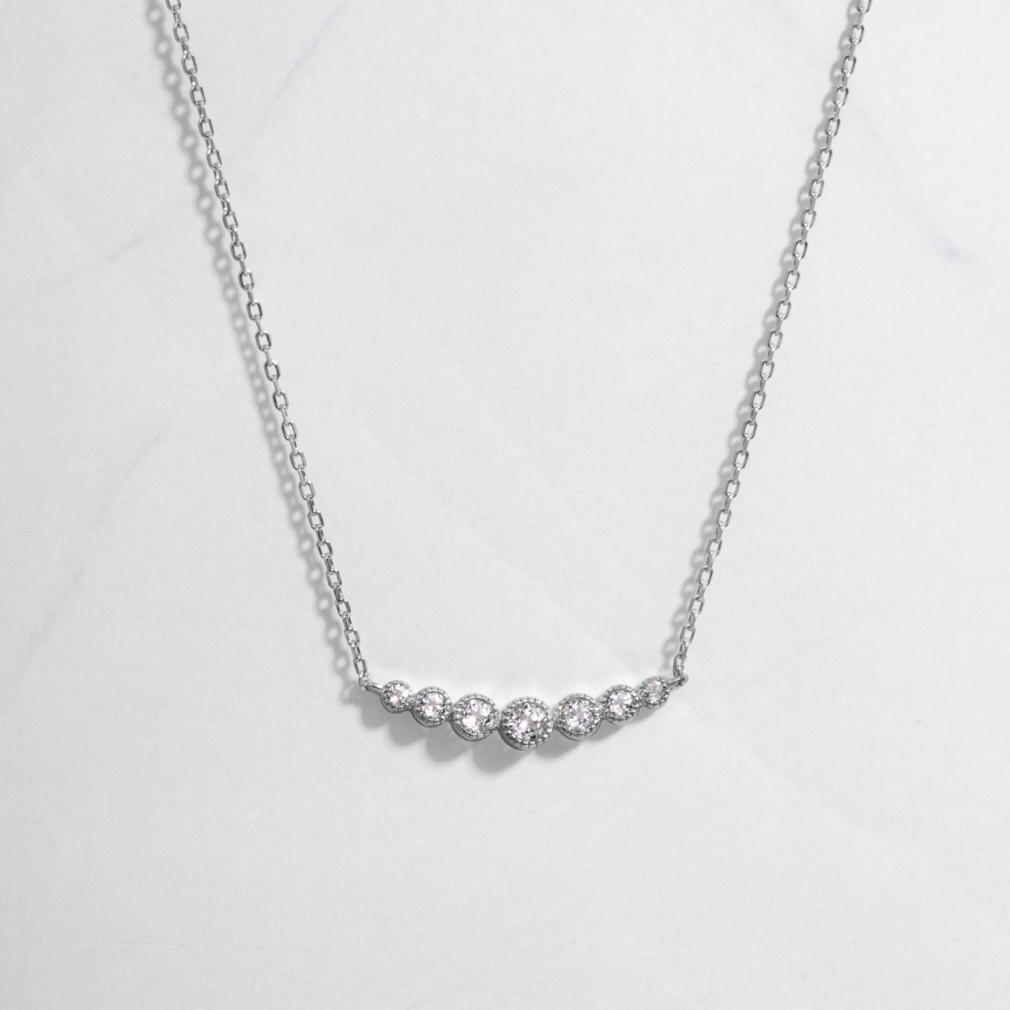 U Curved Diamond Bezel Necklace in silver on white background